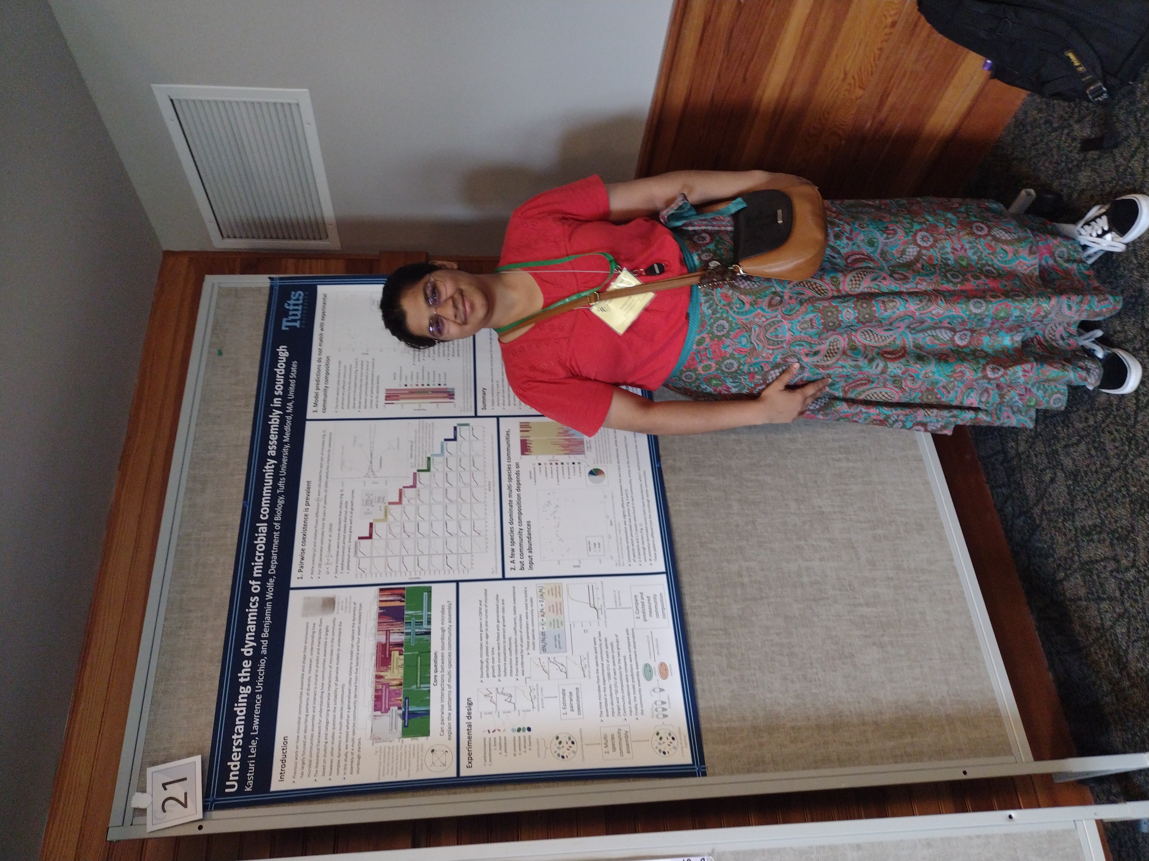 Kasturi presents in front of her poster at a Gordon Conference on Microbial Ecology